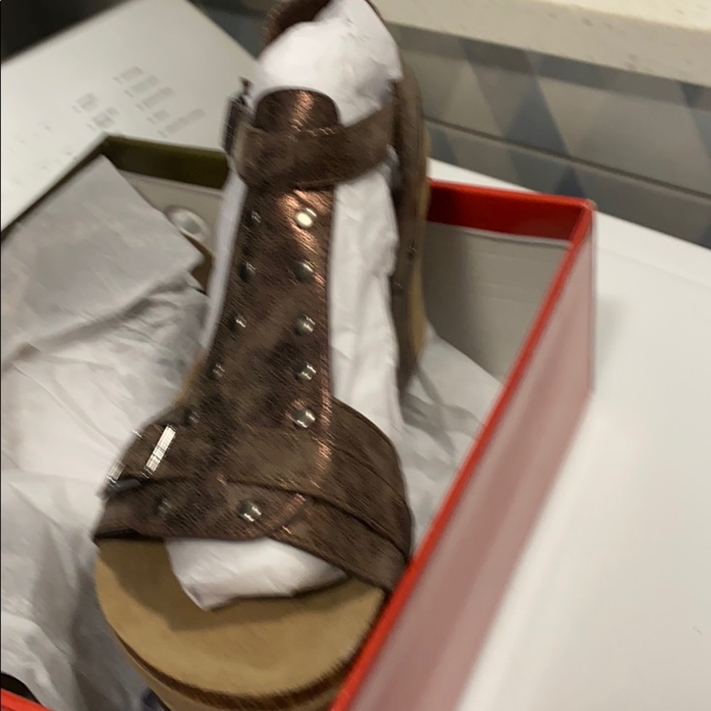 Brown wedges. Brand new in the box never worn